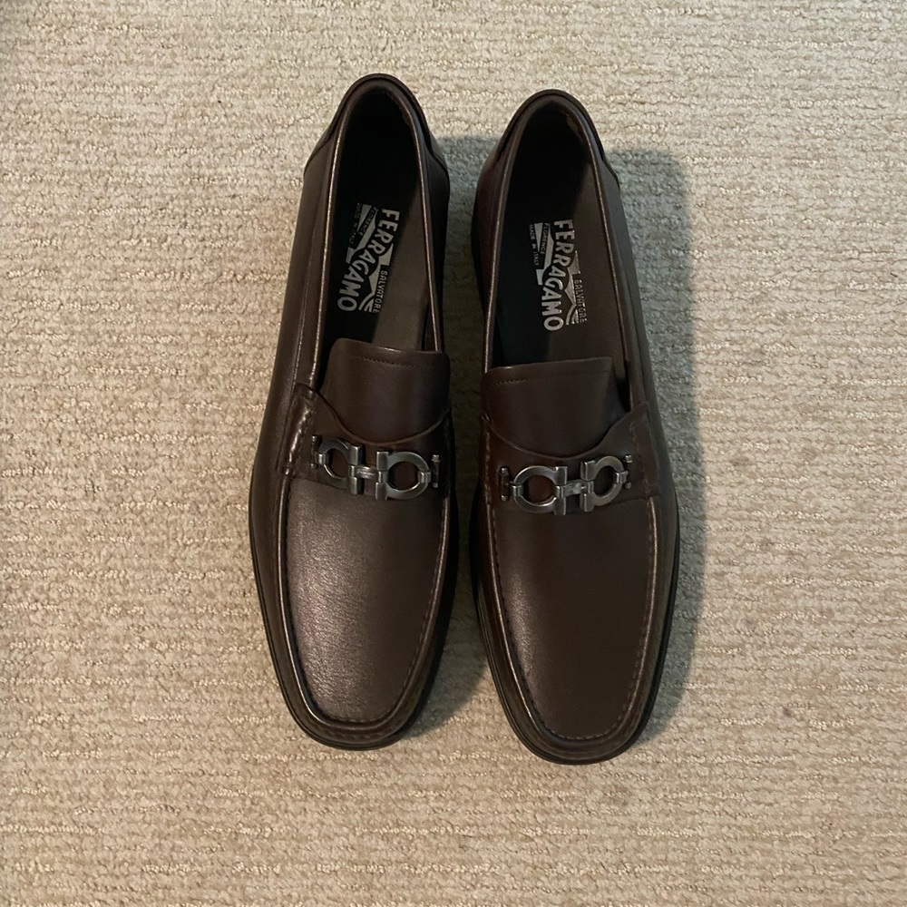 Never worn Ferragamo brown dress shoes.  Left sole needs repaired.